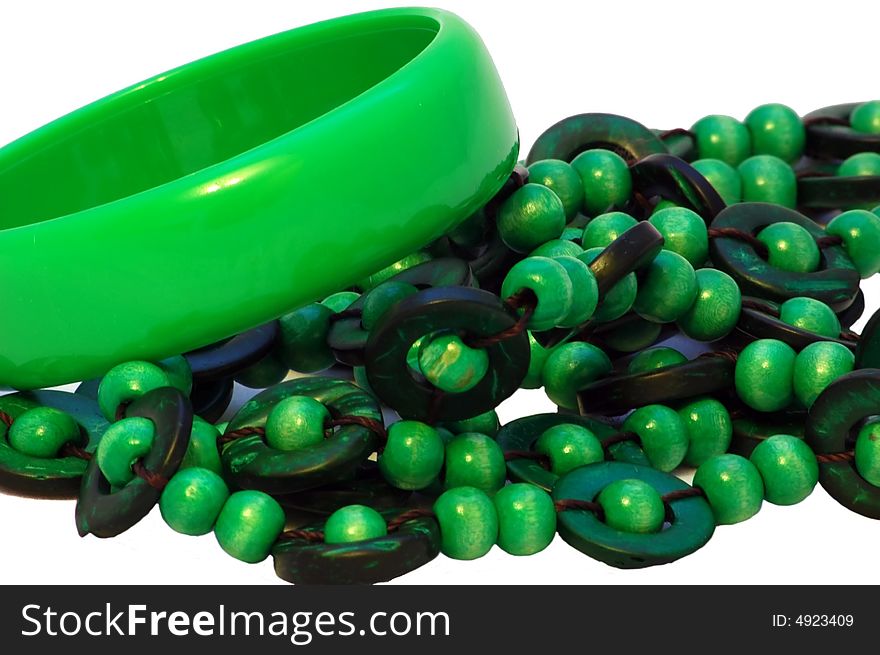 Green plastic bracelet and beads isolated on the white background. Green plastic bracelet and beads isolated on the white background