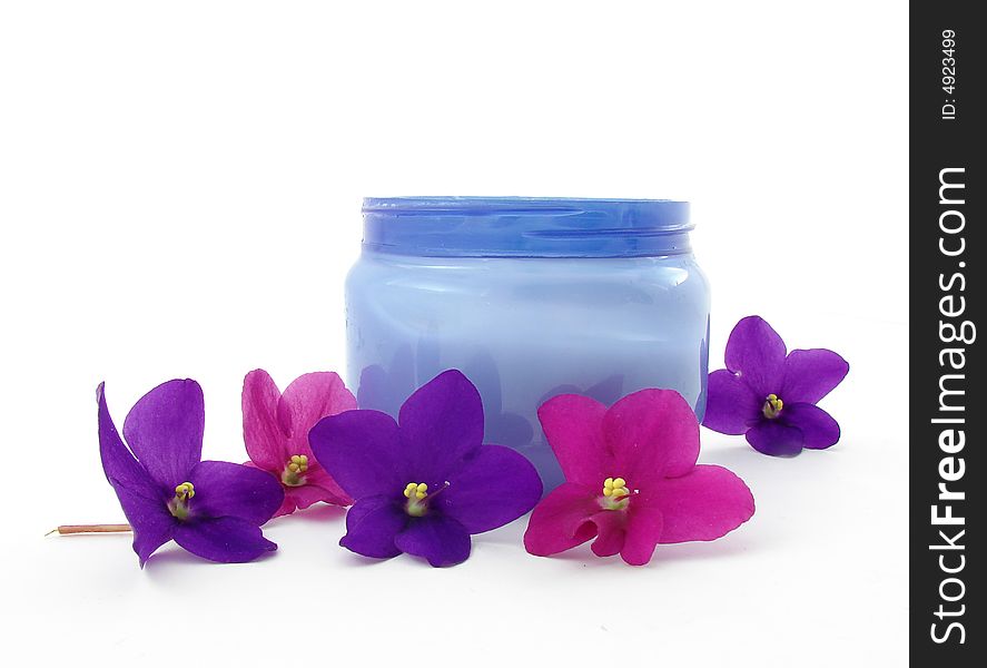 Violets and bod cream isolated on white background. Violets and bod cream isolated on white background.