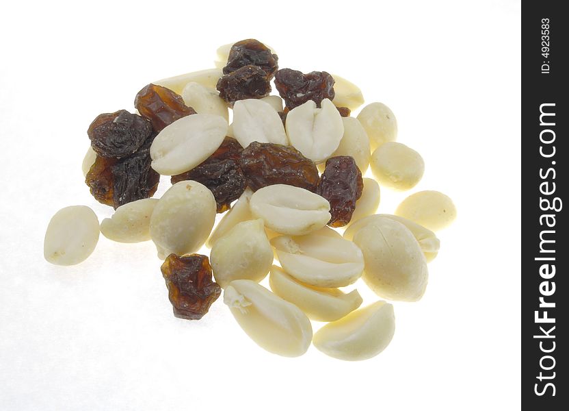 Raisins and half peanuts isolated on a white background. Raisins and half peanuts isolated on a white background