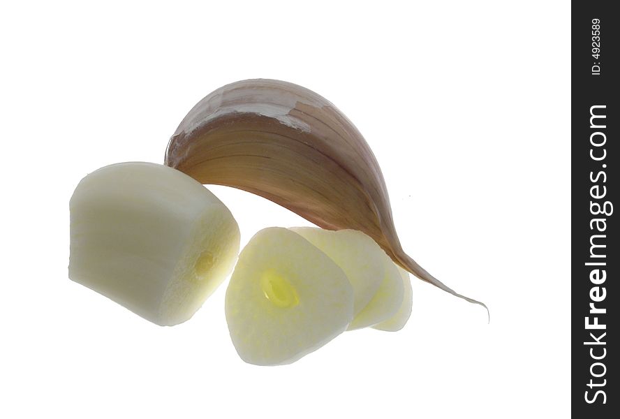 Garlic clove with clopped clove isolated on white background