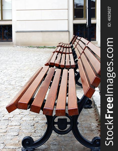 Brown wood public benches in Poland