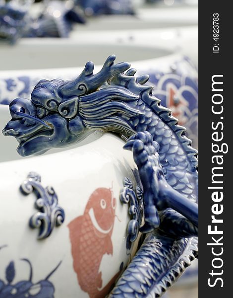The Chinese porcelain is made decorating on the jar. Dragon shape. The Chinese porcelain is made decorating on the jar. Dragon shape.