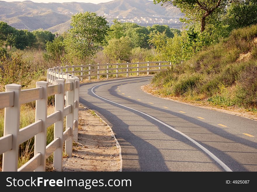 A bike path winds through the hills.