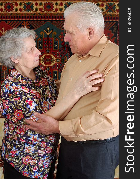 Dancing senior couple at home