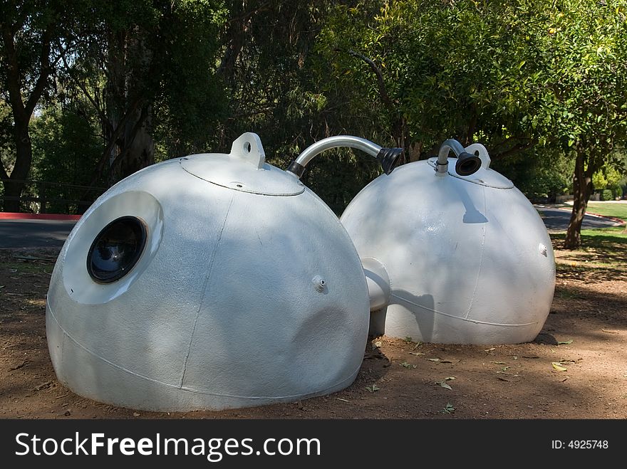 Nautical buoys transformed into water tanks in the garden