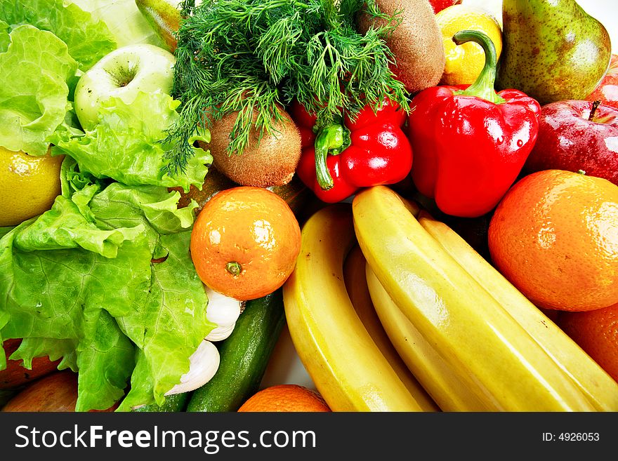 Fresh Vegetables, Fruits and other foodstuffs. Shot in a studio. Fresh Vegetables, Fruits and other foodstuffs. Shot in a studio.