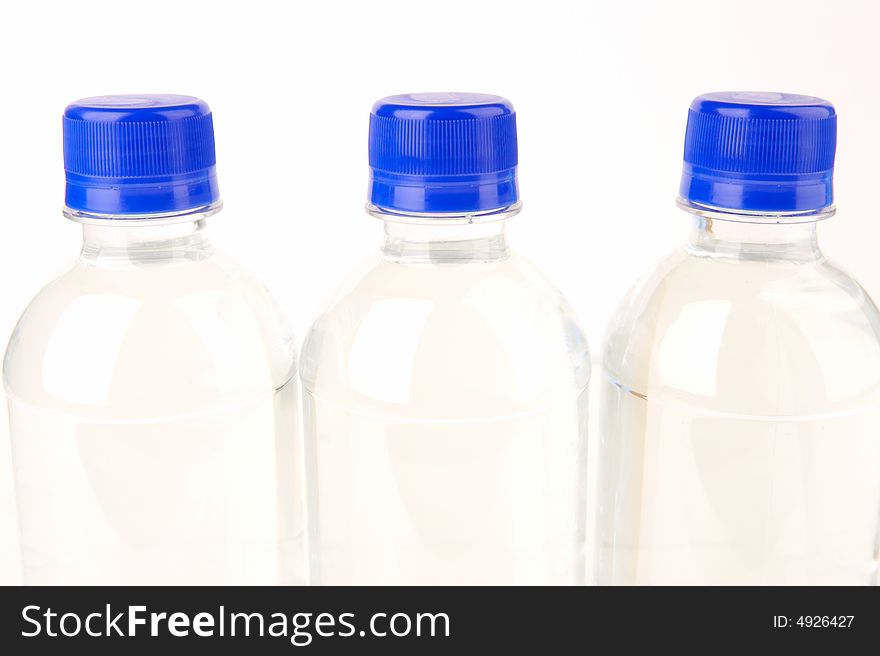 Bottled water isolated against a white background