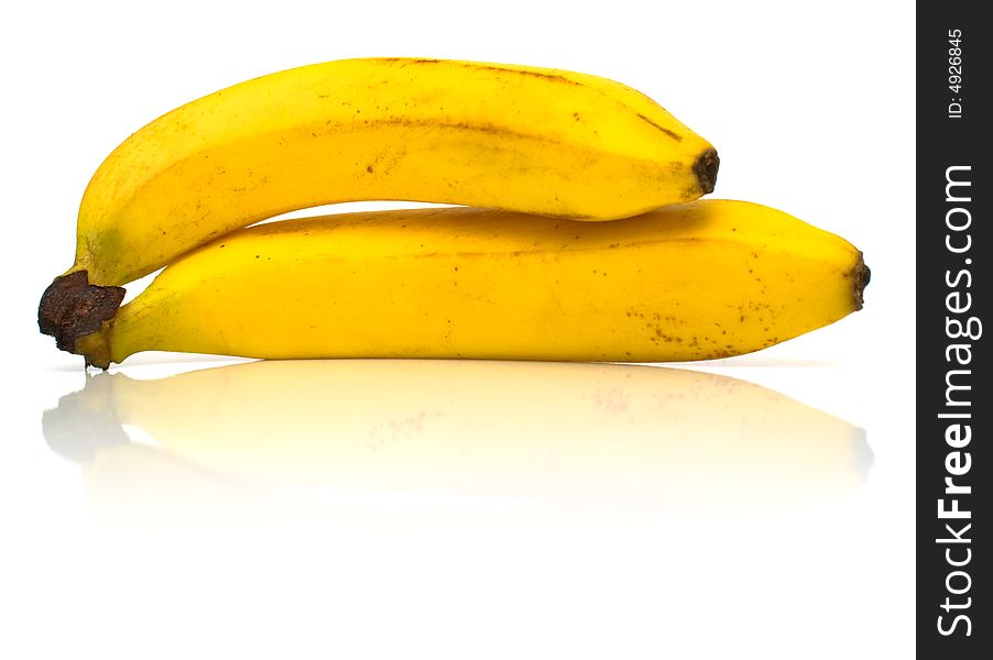 Ripe bananas on white. Shallow DOF.