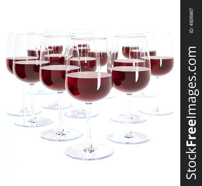 A luxury arrangment of red wine glasses on a white background.
