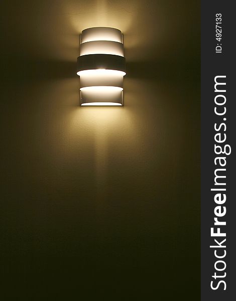 Lamp shade in a wall at night