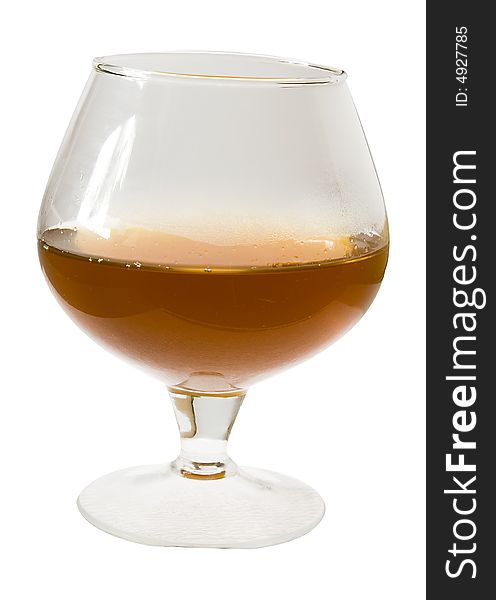 Isolated glass of warm cognac