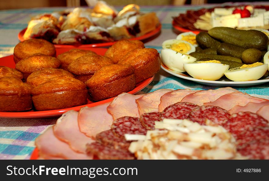 Appetizing served meat, eggs, cucumber, backed pastry on table. Appetizing served meat, eggs, cucumber, backed pastry on table