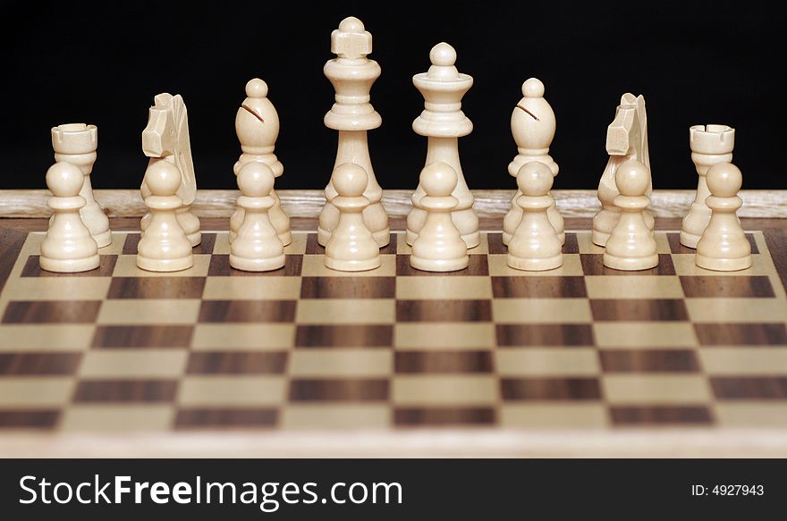 White Chess Pieces On Chessboard,Focus On Back Row