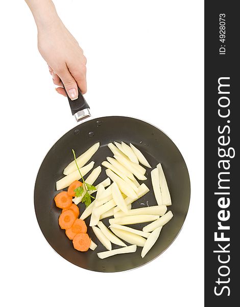 Preparing food, fries and carrots in a pan. Preparing food, fries and carrots in a pan