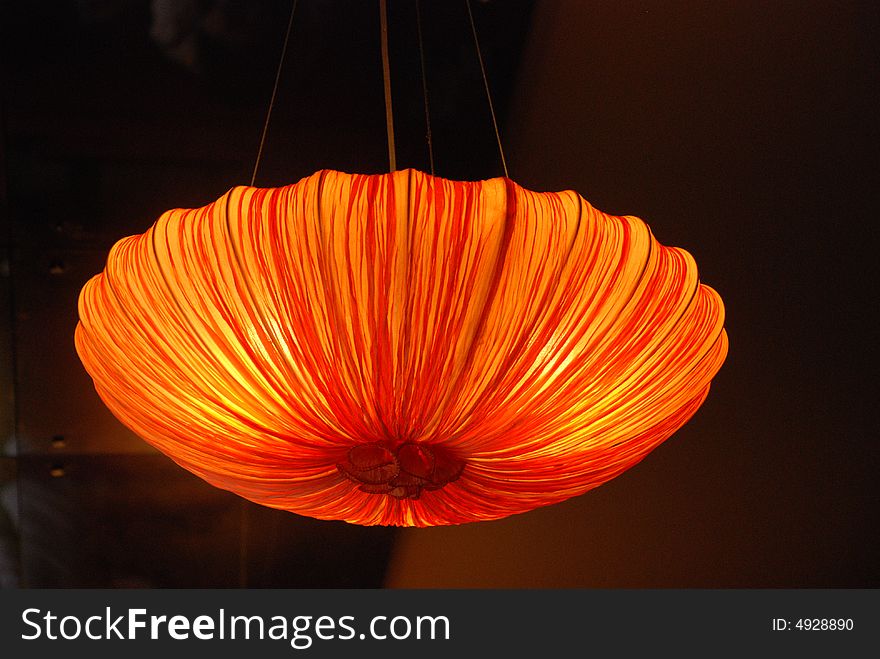 The pendant lamp wrapped with colored gauze.