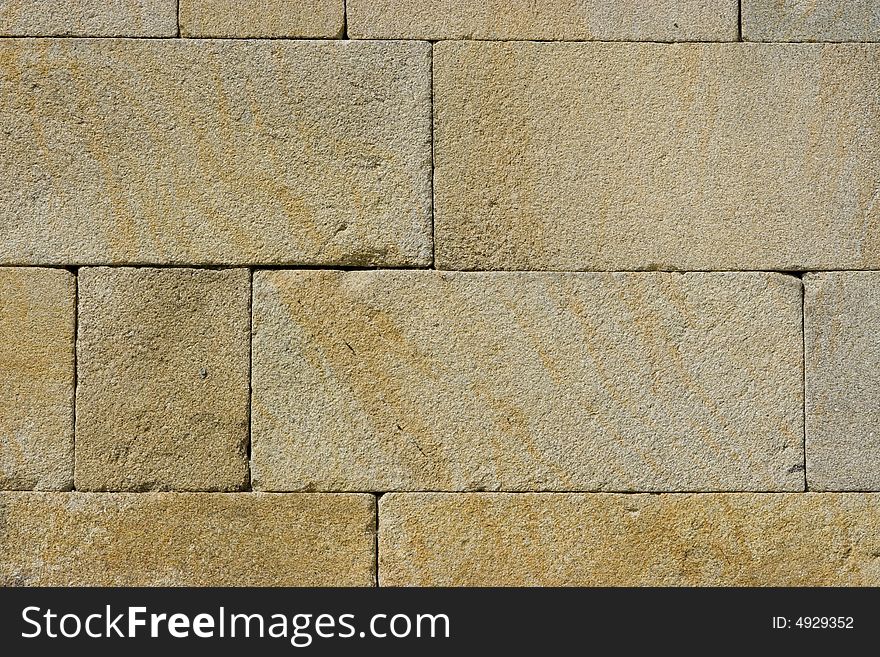 Texture of a wall made of granite. Texture of a wall made of granite