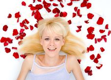 Beautiful Young Woman Throwing Rose Petals Stock Image
