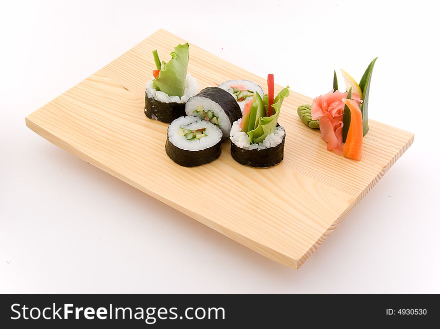 Vegetarian roll on wooden plate
