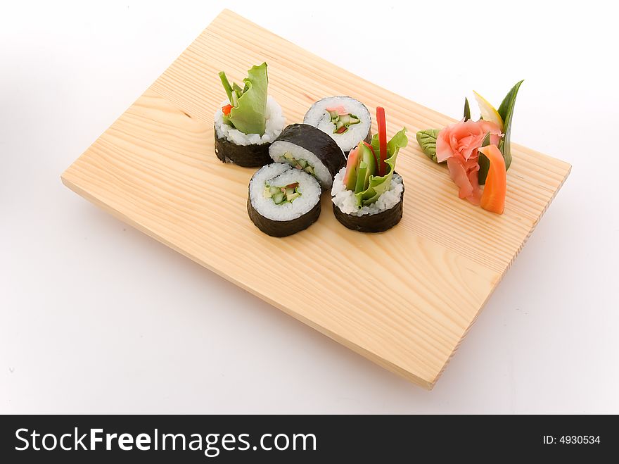 Vegetarian roll on wooden plate. Vegetarian roll on wooden plate