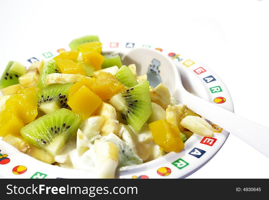 Fruit salad in a plate isolated on a white background. Fruit salad in a plate isolated on a white background