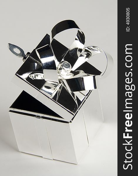 Gift box made of steel isolated over light background