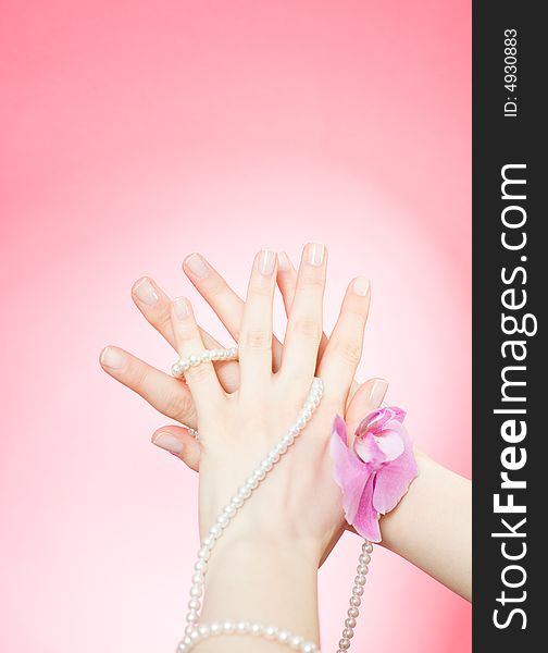 Female hands on the pink background / copyspace