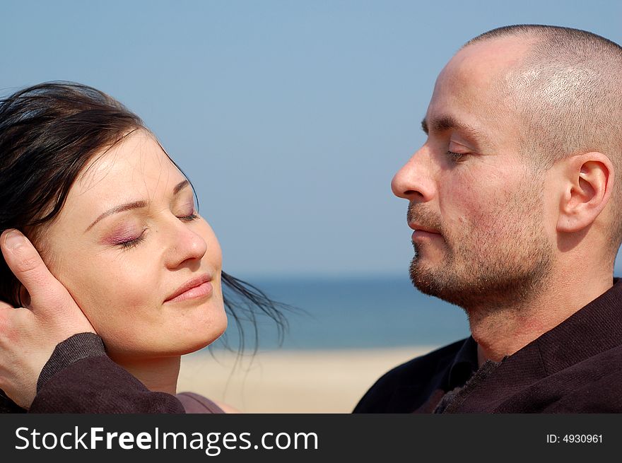 Happy and loving couple on the beach