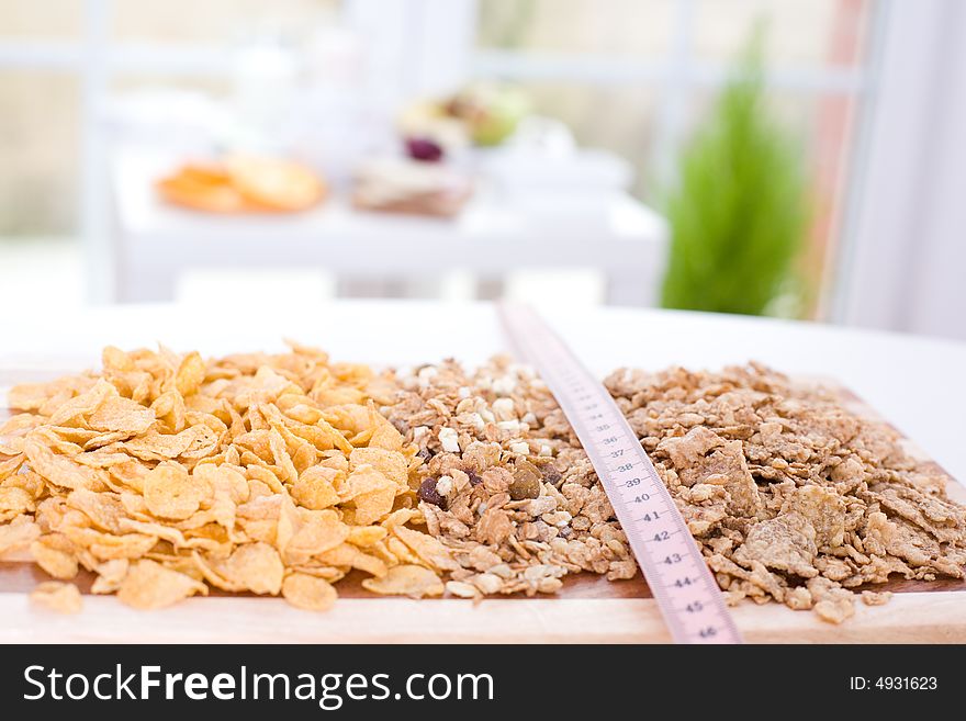 Cereal on the board and measure tape / diet. Cereal on the board and measure tape / diet