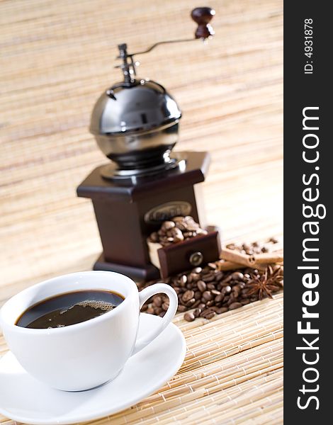 Black coffee, grinder and coffee beans