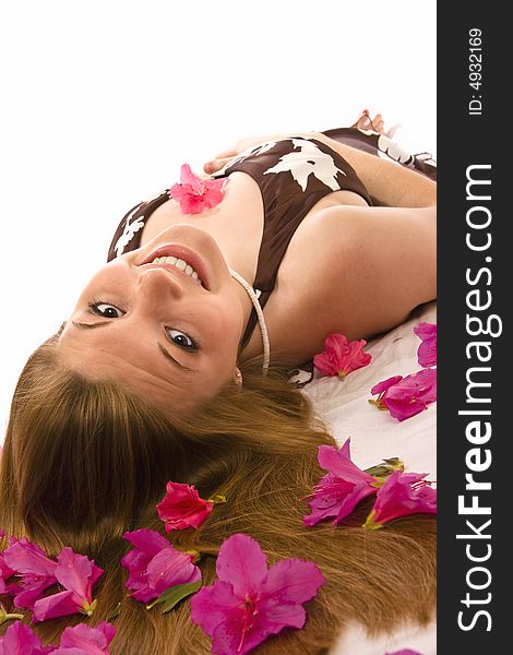 Beautiful woman lying down, azaleas spread through hair. Beautiful woman lying down, azaleas spread through hair.