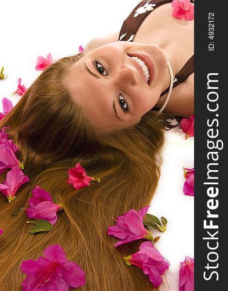 Beautiful woman lying down, azaleas spread through hair. Beautiful woman lying down, azaleas spread through hair.