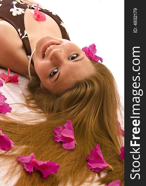 Beautiful woman lying down, azaleas spread through hair. Beautiful woman lying down, azaleas spread through hair.