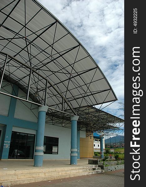 Left side University Gym building with sky as a background