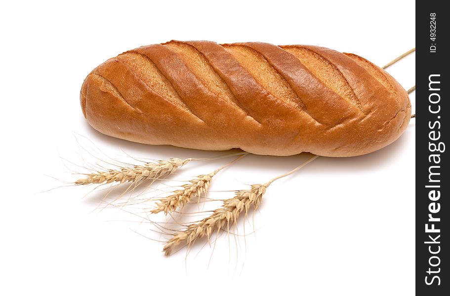 Bread and wheat on a white background