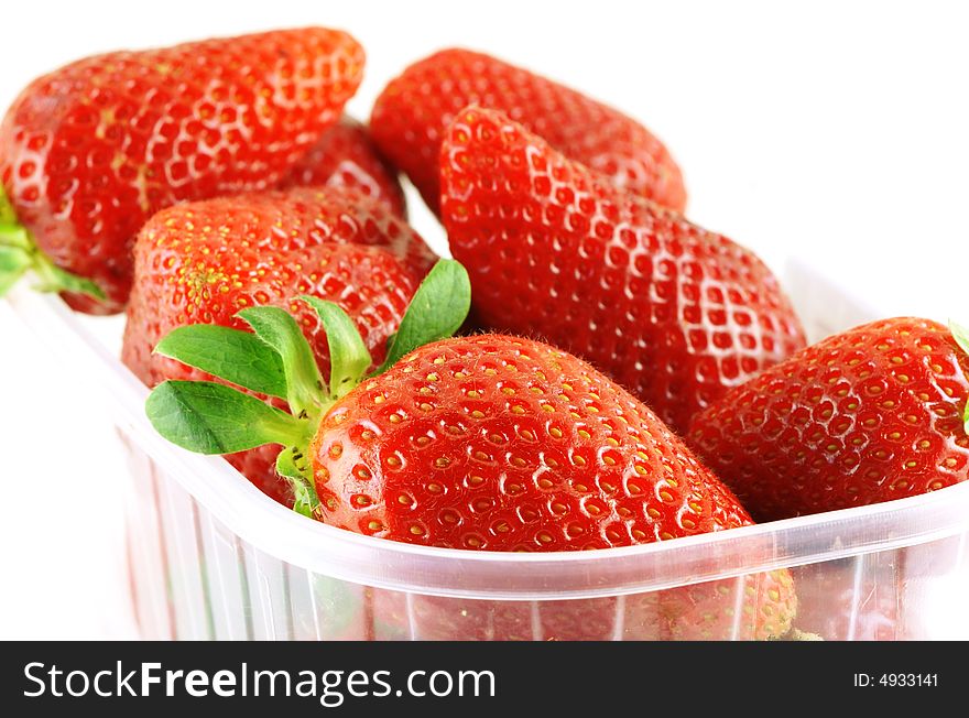 Close up of a container full of fresh strawberry