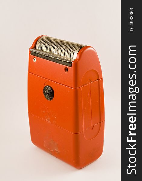 A red old electric shaver