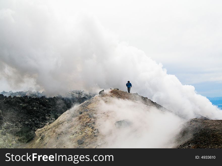 The Tourist on the top of volcano. Kamchatka