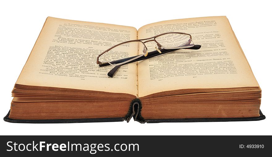 Old Russian book with glasses, isolated on white.