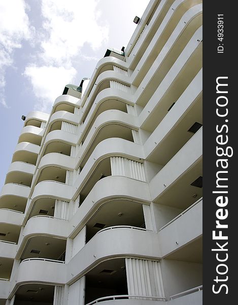 Exterior side wall of apartment building with pattern of balconies