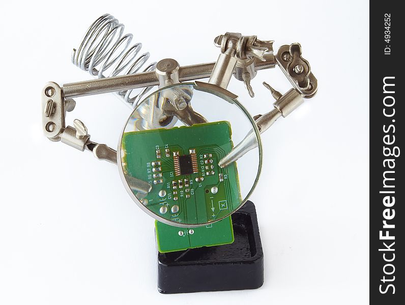 Stand for soldering iron with loupe and electonic circuit