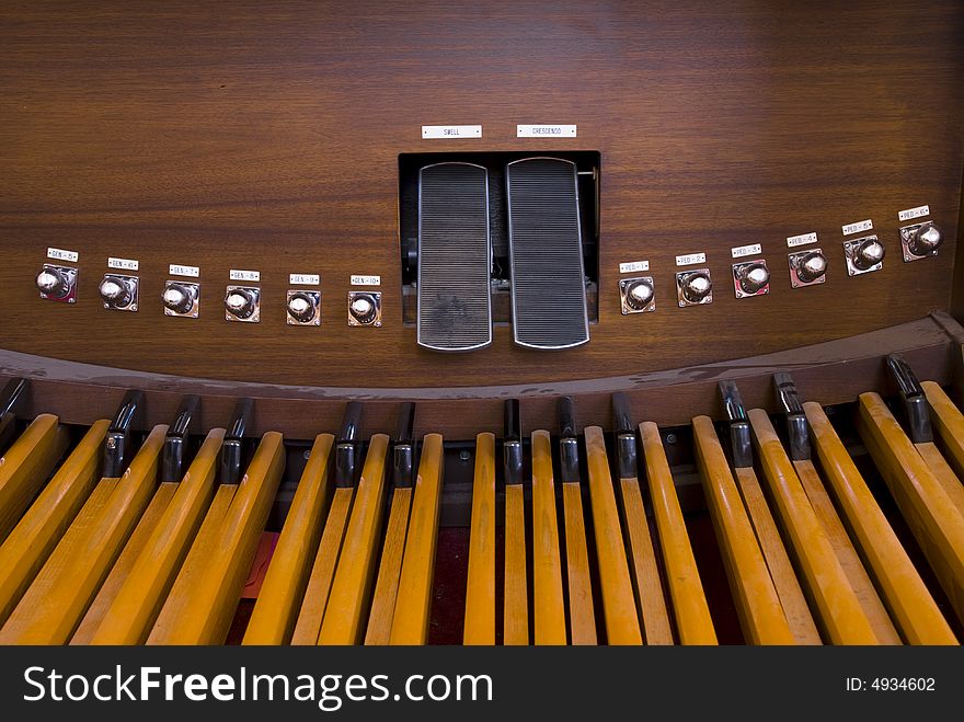 Picture of organ pedals inside a church. Picture of organ pedals inside a church