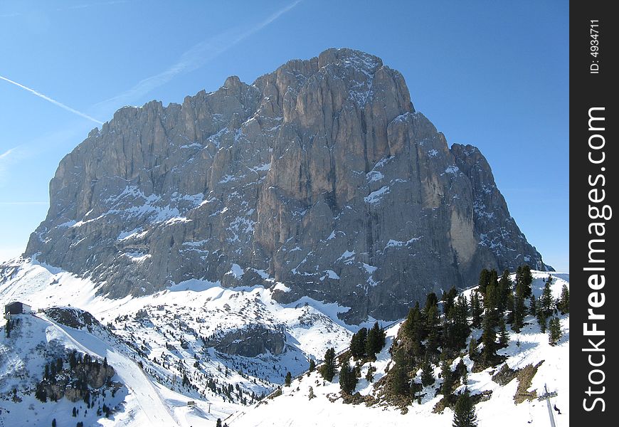 Mount Sassolungo during winter with snow. Mount Sassolungo during winter with snow