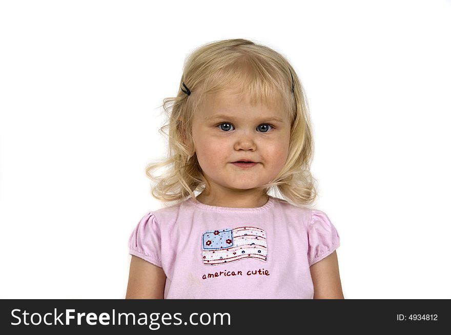 Blond baby girl with a cute expression. Blond baby girl with a cute expression.