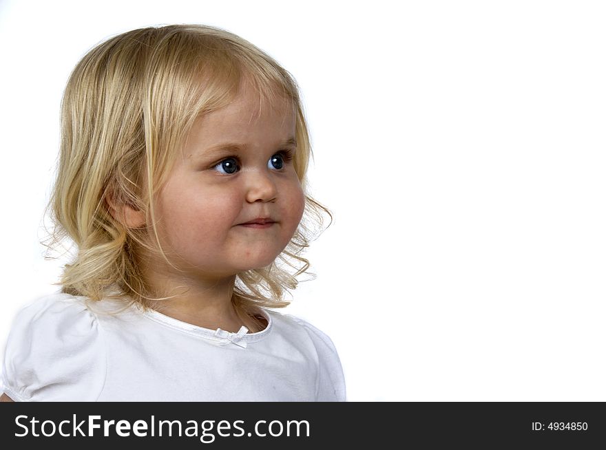 Blond baby girl with a cute expression. Blond baby girl with a cute expression.