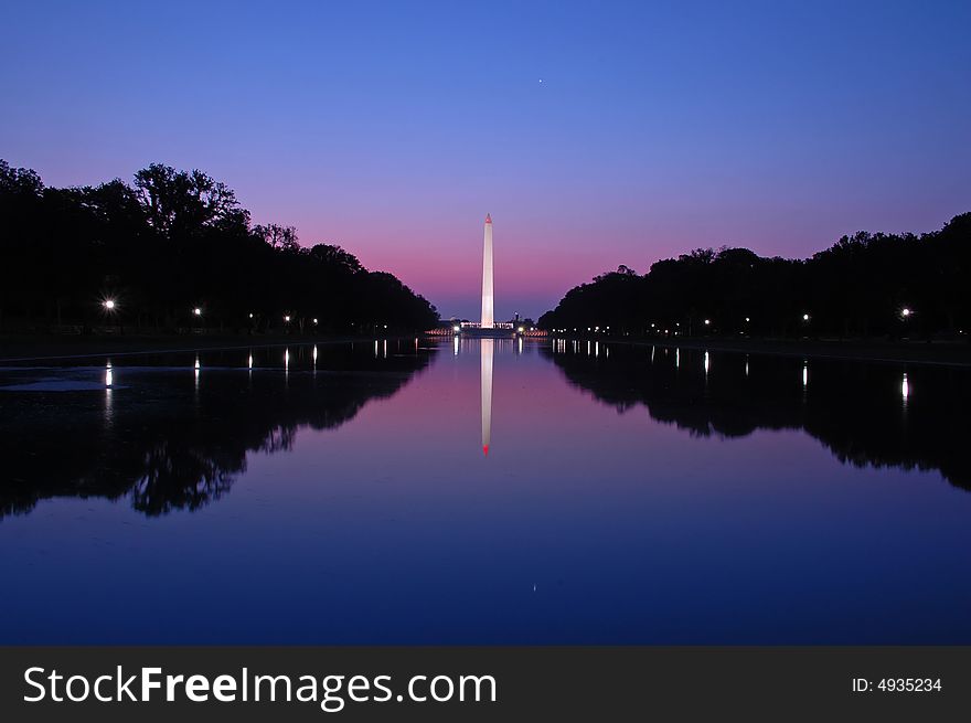 Washington monument in DC at dawn from across the reflecting pool