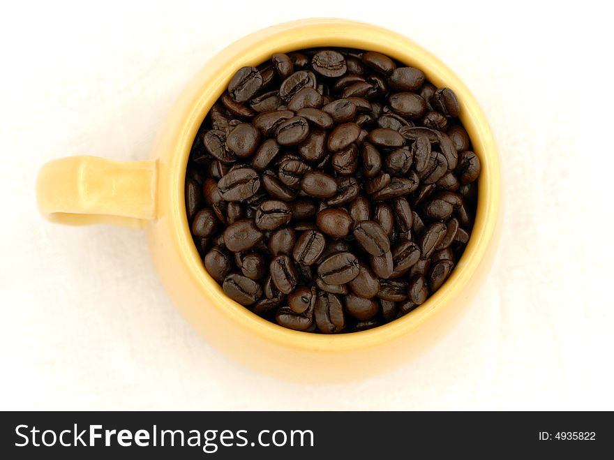 Cup of Dark Roast Coffee Beans