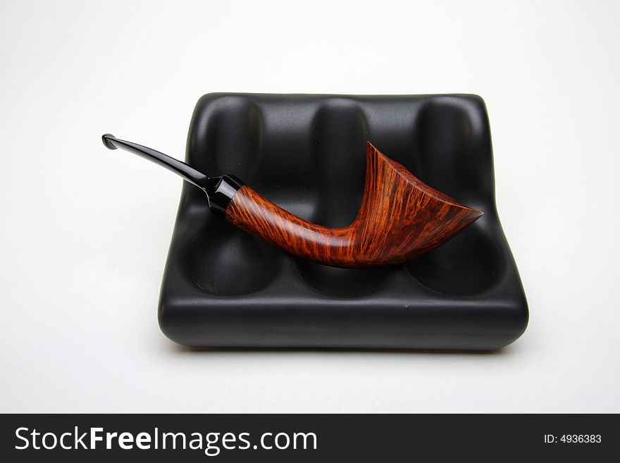 Tobacco pipe isolated on white.