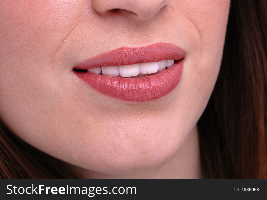 Close shot of beautiful feminine lips with mouth slightly parted. Close shot of beautiful feminine lips with mouth slightly parted
