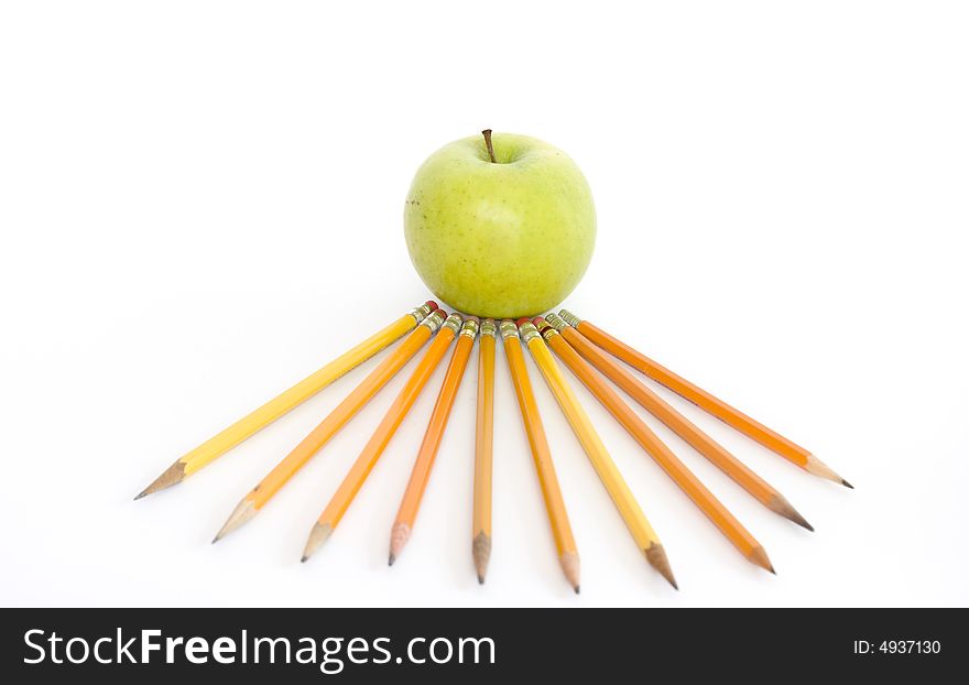 Colorful pencils and apple on white. Colorful pencils and apple on white