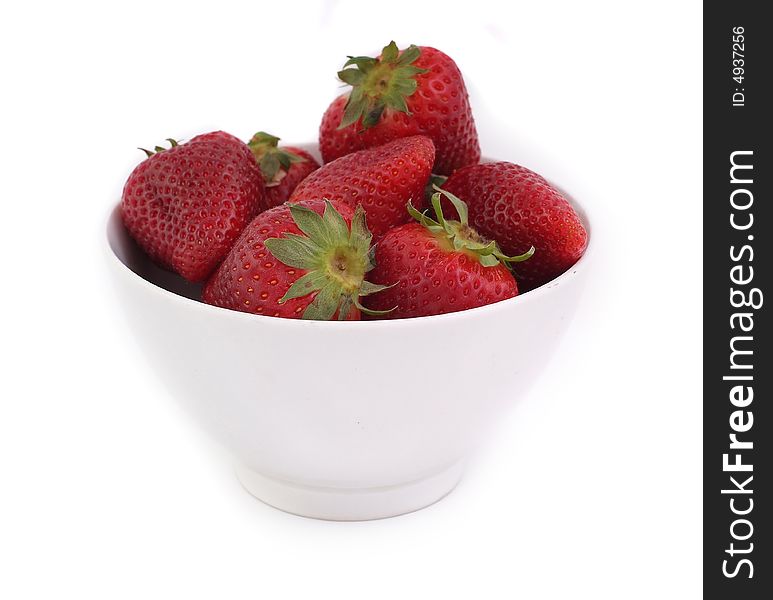 Red strawberries in white bowl on white background, fresh and tasty. Red strawberries in white bowl on white background, fresh and tasty